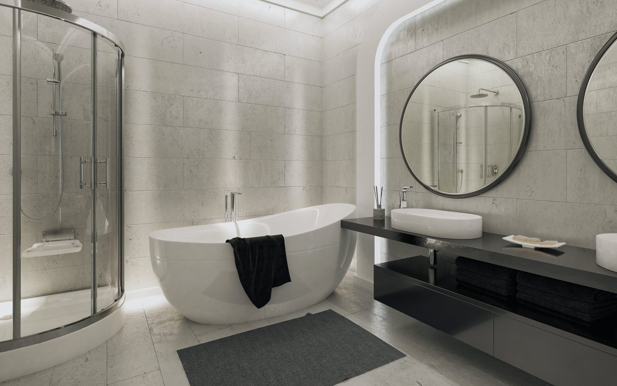Remodeled bathroom in Saugus with a freestanding tub and a glass enclosed tiled shower